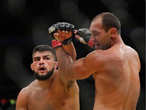 Kelvin Gastelum punches Johny Hendricks during the UFC 200 event at T-Mobile Arena on July 9, 2016 in Las Vegas.