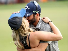 Adam Hadwin of Canada celebrates with fiancee Jessica Dawn on the 18th green after winning the Valspar Championship  during the final round at Innisbrook Resort Copperhead Course on March 12, 2017 in Palm Harbor, Florida. Hadwin won with a score of -14.