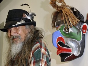 Artist Beau Dick with one of his masks.