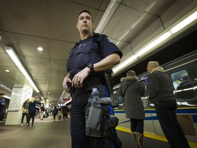 A Transit Police office with a new CEW ( Conducted Energy Weapon) at Waterfront Station in Vancouver on December 21, 2016.