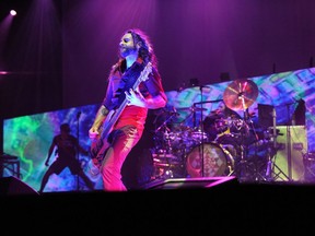 Bass player Justin Chancellor, with drummer Danny Carey of "Tool" at Rogers Arena in Vancouver, July 9, 2010.  Singer Maynard James Keenan is at the left in the background.
