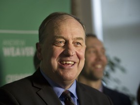 B.C. Green party leader Andrew Weaver is all smiles at a Vancouver news conference on Wednesday. His party’s support has jumped four per cent on Vancouver Island, according to a new Mainstreet Research poll.