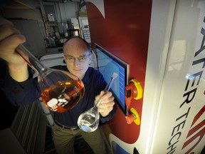 FILE PHOTO - Jonathan Rhone is the CEO of Axine Water Technologies, shown here with an innovative water portable treatment solution in Vancouver on March 29, 2016. Axine belongs to the green tech industry.