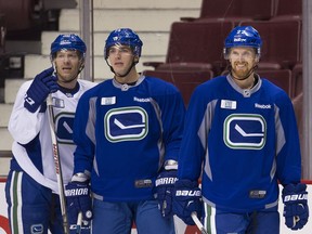 The departure of Jannik Hansen (left) and Alex Burrows (centre) deprives the Canucks of their veteran heart and soul and Daniel Sedin (right) and his brother Henrik without longtime friends on the team.