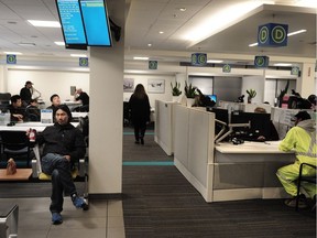 Builders and the public wait for hours in the permit and planning department of City Hall in Vancouver.