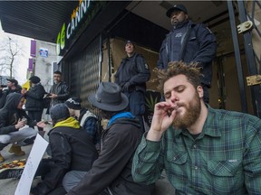 Supporters of Marc and Jodie Emery, who were arrested in Toronto Wednesday, protest the Vancouver police raid the Cannabis Culture store on Hastings Street.