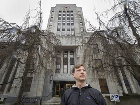 Daniel Oleksiuk, co-founder of Abundant Housing Vancouver, said council needs to get the message that there is a housing crisis in the city and thousands of units need to be built quickly. He is shown standing on the steps of city hall.
