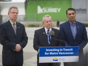 Peter Fassbender, the provincial minister responsible for TransLink, is flanked by Surrey Liberal MLAs Marvin Hunt (left) and Amrik Virk (right) at Friday’s announcement in Surrey on the province matching $2.2 billion in federal funding for Metro Vancouver transit expansion projects. British Columbians go to the polls on May 9 in a provincial election.