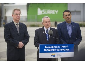 Left to right: MLA Marvin Hunt, Peter Fassbender and MLA Amrik Virk speak to reporters at Surrey City Hall on Friday, March 31, 2017. The B.C. Liberals are promising to match federal funding for Metro Vancouver's transit plan.
