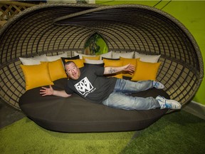 Rick Alyea, of 604 Wholesale, stretches out on the latest style in patio furniture.