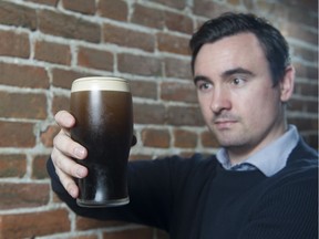 Darren Pierce, operations manager for the Heather Hospitality Group, shows off a perfectly poured pint of Guinness stout at the Irish Heather in Vancouver on Wednesday. He says a neat crown of foam slightly higher than the rim of the glass tells the drinker he’s getting all the beer he paid for.