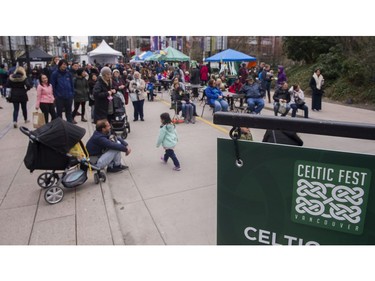 An afternoon crowd gathers the Celtic Fest set up on Robson st to celebrate St. Patrick's Day Vancouver March 17 2017.