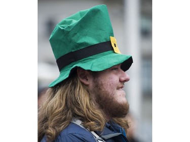 Edward Peters watches the De Danaan Dancers perform at the Celtic Fest set up on Robson st to celebrate St. Patrick's Day Vancouver March 17 2017.