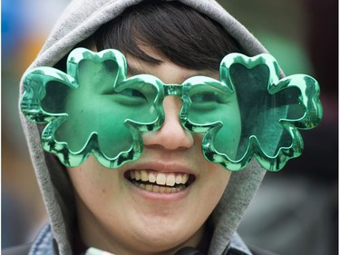Noah Park sports green shamrock glasses at the Celtic Fest set up on Robson st to celebrate St. Patrick's Day Vancouver March 17 2017.