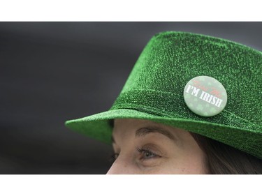 Teghann Docherty wears a " Kiss me I'm Irish button" on her green hat at the Celtic Fest set up on Robson st to celebrate St. Patrick's Day Vancouver March 17 2017.