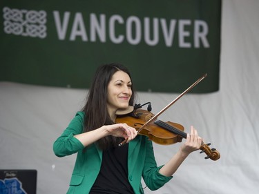 The Jocelyn Pettit Trio performs at the Celtic Fest set up on Robson st to celebrate St. Patrick's Day Vancouver March 17 2017.