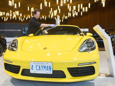 A Porsche Cayman gets a dusting at the Vancouver Auto Show at Vancouver Convention Centre West, Vancouver March 28 2017.