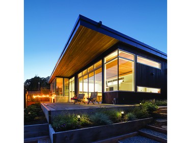 Situated on a bluff above the sandy beach of Cadboro Bay on Vancouver Island, this house was designed for a young, growing family.