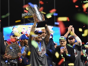 Toronto Blue Jays — and former Vancouver Canadians — pitcher Marcus Stroman hoists the championship trophy on Wednesday after he led the United States to an 8-0 win over Puerto Rico at the World Baseball Classic at Los Angeles’s Dodger Stadium. Stroman was also named tournament MVP.