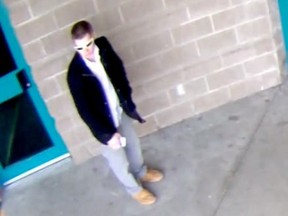 This image taken from surveillance video shows a man who took a bicycle from a child at the Nanaimo Aquatic Centre. He is 25 to 35 years old, five feet six inches tall with a thin bulld and short blond hair.