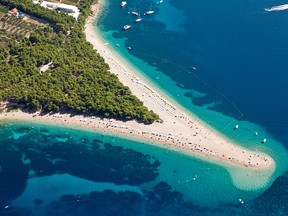 Aerial photograph of famous Zlatni rat beach in Bol, Brac Island
