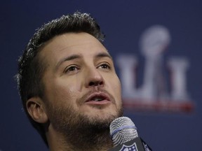 FILE - In this Feb. 2, 2017 file photo, Luke Bryan answers questions at a news conference for the NFL Super Bowl 51 football game in Houston. The Academy of Country Music Awards will unite the democrats and republicans, according to the show‚Äôs host, and part-time comedian, Luke Bryan. &ampquot;Coming to an election near you. Is politics your next career?‚Äù chimed in fellow country singer Dierks Bentley, who will co-host the show with Bryan on Sunday, April 2, 2017. (AP Photo/Morry Gash)