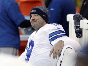 FILE - In this Jan. 1, 2017, file photo, Dallas Cowboys&#039; Tony Romo smiles on the bench during the second half of an NFL football game against the Philadelphia Eagles in Philadelphia. A person with knowledge of the decision says Romo is retiring rather than trying to chase a Super Bowl with another team after losing his starting job with the Dallas Cowboys. The all-time passing leader for the storied franchise is headed to the broadcast booth after considering those offers. The person spoke to Th