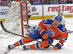 Zack Kassian (44) of the Edmonton Oilers falls after missing the net on a against Martin Jones of the San Jose Sharks at Rogers Place in Edmonton on April 14,  2017.