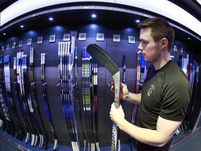 VANCOUVER, BC - FEBRUARY 4: Brendan Gaunce #50 of the Vancouver Canucks picks his game sticks before their NHL game against the Minnesota Wild at Rogers Arena February 4, 2017 in Vancouver, British Columbia, Canada.  (Photo by Jeff Vinnick/NHLI via Getty Images)