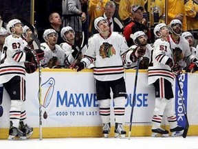 Chicago Blackhawks watch as a goal by the Nashville Predators is reviewed during the third period in Game 4 of a first-round NHL hockey playoff series Thursday, April 20, 2017, in Nashville, Tenn. The goal was ruled good. The Predators won 4-1 and swept the series. (AP Photo/Mark Humphrey)