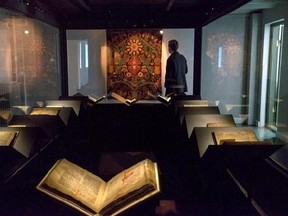 In this photo taken Saturday, April 15, 2017, a law book penned on calf-skin in 1363 is displayed at a museum in Reykjavik. The revered Icelandic language, seen by many as a source of identity and pride, is being undermined by the widespread use of English both for mass tourism and in the voice-controlled artificial intelligence devices coming into vogue. (AP Photo/Egill Bjarnason)
