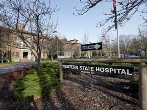 FILE - In this file photo taken April 11, 2017, the entrance to Western State Hospital is seen in Lakewood, Wash. Inspectors who visited Washington state‚Äôs largest psychiatric hospital found that safety problems that thrust the facility into the national spotlight after the escape of two dangerous patients a year ago persist, including neglected patients. (AP Photo/Elaine Thompson, File)