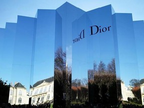 FILE - In this Jan.25, 2016 file photo, the Rodin museum, venue for Christian Dior&#039;s Spring- Summer 2016 Haute Couture fashion collection, is reflected in Paris. The magnate behind the LVMH luxury empire is seeking to strengthen control over Christian Dior in a multibillion-dollar deal combining the fashion industry heavyweights. (AP Photo/Thibault Camus, File)