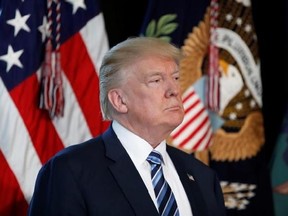 FILE - In this Friday, April 21, 2017, file photo, President Donald Trump listens as Treasury Secretary Steve Mnuchin speaks at the Treasury Department in Washington. Trump won the White House by arguing that what America needed was a president who had proved himself as a steely and successful corporate leader with no political baggage, someone, say, like himself. Yet 100 days into Trump‚Äôs presidency, the businessman-as-president has struggled to apply his experience as a real estate and enter