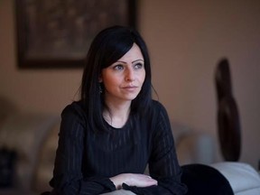 Jilian Derksen sits for a portrait in her home in Kitchener, Ont., on Thursday, April 6, 2017. Derksen&#039;s husband died in June 2016, 10 months shy of her 35th birthday leaving her without any access to CPP survivor benefits. She now has to wait 30 years for the benefits.THE CANADIAN PRESS/Hannah Yoon
