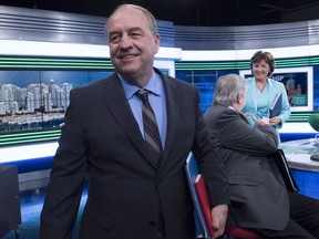 B.C. Green Party leader Andrew Weaver is seen leaving the studio following the leaders debate in Vancouver, B.C., Thursday, April 20, 2017.