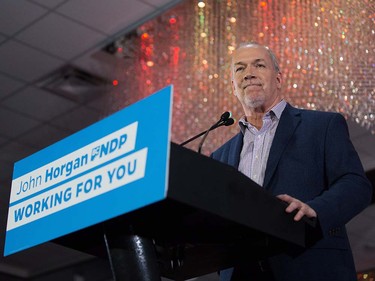 NDP Leader John Horgan pauses while addressing supporters during an election campaign kickoff rally in Surrey, B.C., on Sunday April 9, 2017. A provincial election will be held on May 9.