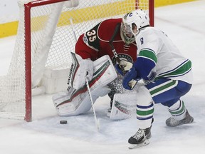 Vancouver Canucks' Brock Boeser scores against Minnesota Wild goalie Darcy Kuemper as he made his NHL debut in March.