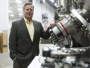 Newly appointed General Fusion CEO Christofer Mowry stands with a plasma injector inside the technology firm's Burnaby laboratories.