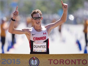 Evan Dunfee of Richmond crosses the finish to win gold in the men's 20-kilometre racewalk at the Pan Am Games in Toronto in 2015. He'll be competing in Sunday's 33rd annual Vancouver Sun Run. THE CANADIAN PRESS/AP