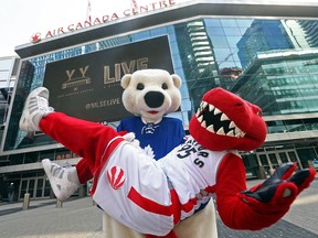 Carlton the Bear and The Raptor out front of the Air Canada Centre at Maple Leaf Square in Toronto as both the Raptors and the Leafs are in their respective league's playoffs.