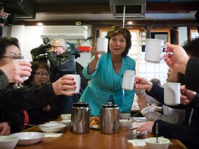 Liberal Leader Christy Clark toasts after serving tea to supporters during a campaign stop at a Korean restaurant in Coquitlam, B.C., on Wednesday April 12, 2017. A provincial election will be held on May 9.