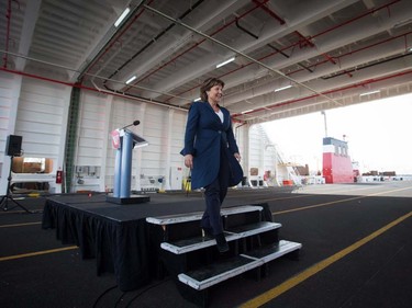 British Columbia Premier Christy Clark steps down from a podium after speaking during a commissioning ceremony for two new Seaspan LNG-fuelled vessels in Delta, B.C., on Sunday April 9, 2017. A provincial election will be held on May 9.