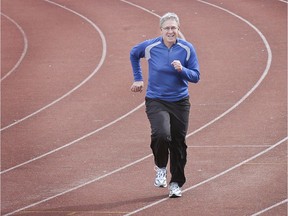 Mike Beamish warms up for the Sun Run in a file photo. His run at the Sun ends this week with his retirement from sports writing.