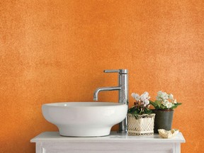 Dulux's Liquid Metal (Royal Pumpkin) is used to give depth and warmth to this powder room.
