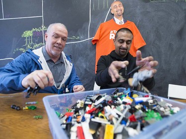 British Columbia NDP leader John Horgan and BC NDP candidate Ravi Kahlon play with lego during a stop at Kahlon's campaign headquarters in North Delta, B.C, Monday, April, 10, 2017.