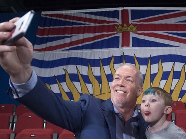 NDP Leader John Horgan takes a selfie with Callum Wilson, age 4, following a campaign gathering in Vancouver, Tuesday, April, 11, 2017.