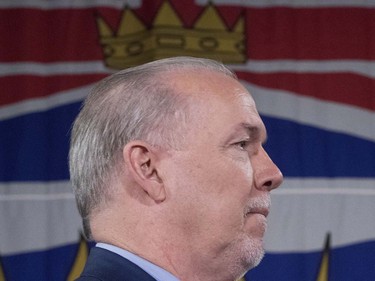 NDP Leader John Horgan pauses for a moment as he addresses a campaign gathering in Vancouver, Tuesday, April, 11, 2017.