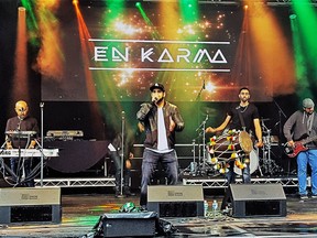 En Karma plays a fusion of traditional Punjabi bhangra music and contemporary amplified sounds.