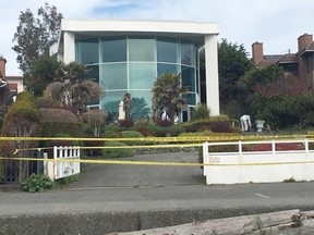 Police collect evidence at 2590 Esplanade in Oak Bay after a man broke into the home and attacked the woman inside with a machete around.